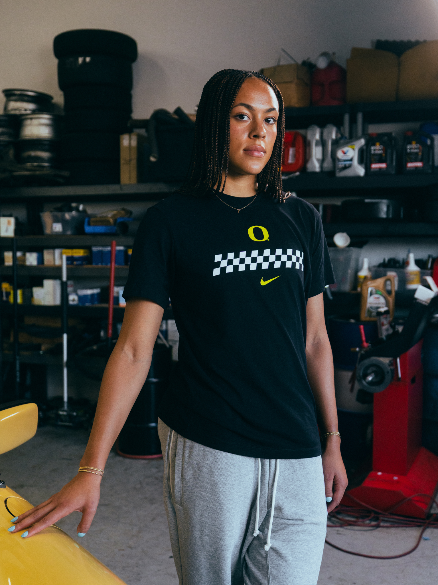 Sofia Bell showing off the front of the DOAF Speedway Tee