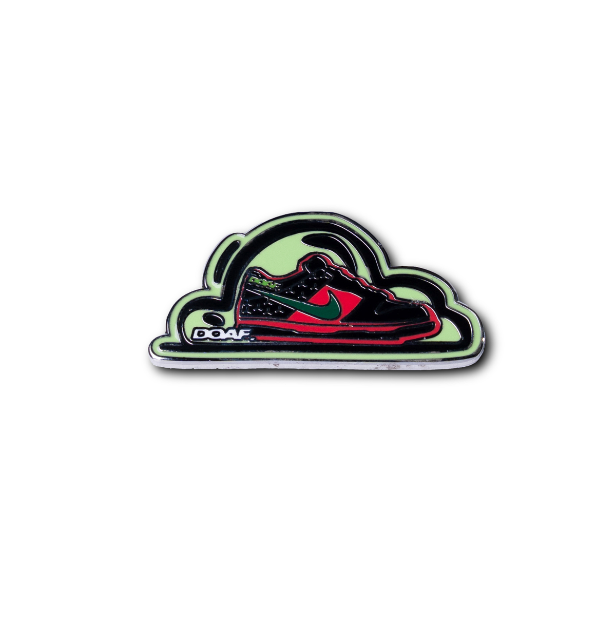 Pin with a shoe design on a white background with a DOAF logo