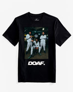 Dante Moore, Dakorien Moore, and Matayo Uiagalelei Rocking DOAF Speedway hoodies and sweatpants. They are standing in front of a car in a garage. Dante is holding a football.