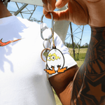 Someone holding a keychain with a DOAF character