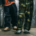 DOAF Air Max sneakers on two people wearing dark pants. 