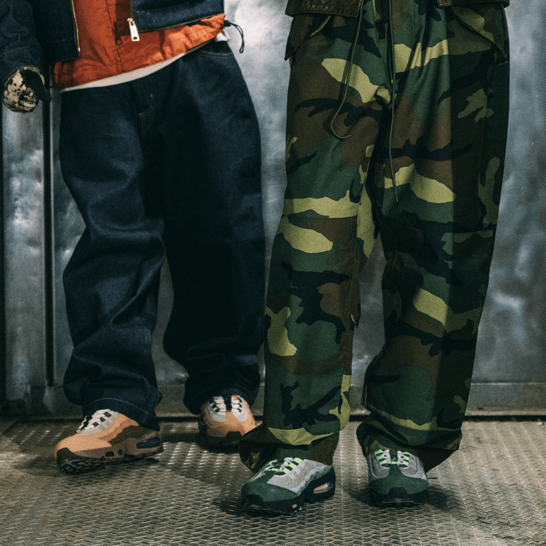 DOAF Air Max sneakers on two people wearing dark pants. 