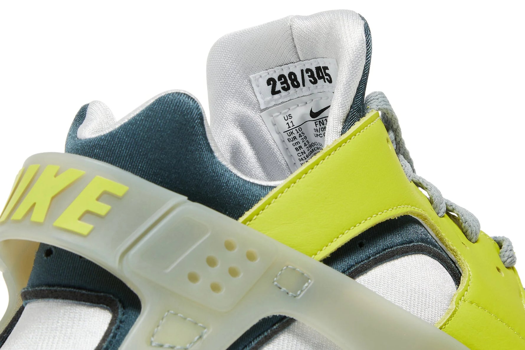 The design features premium construction with neon green leather overlays surrounding the Huarache’s iconic neoprene bootie. 
