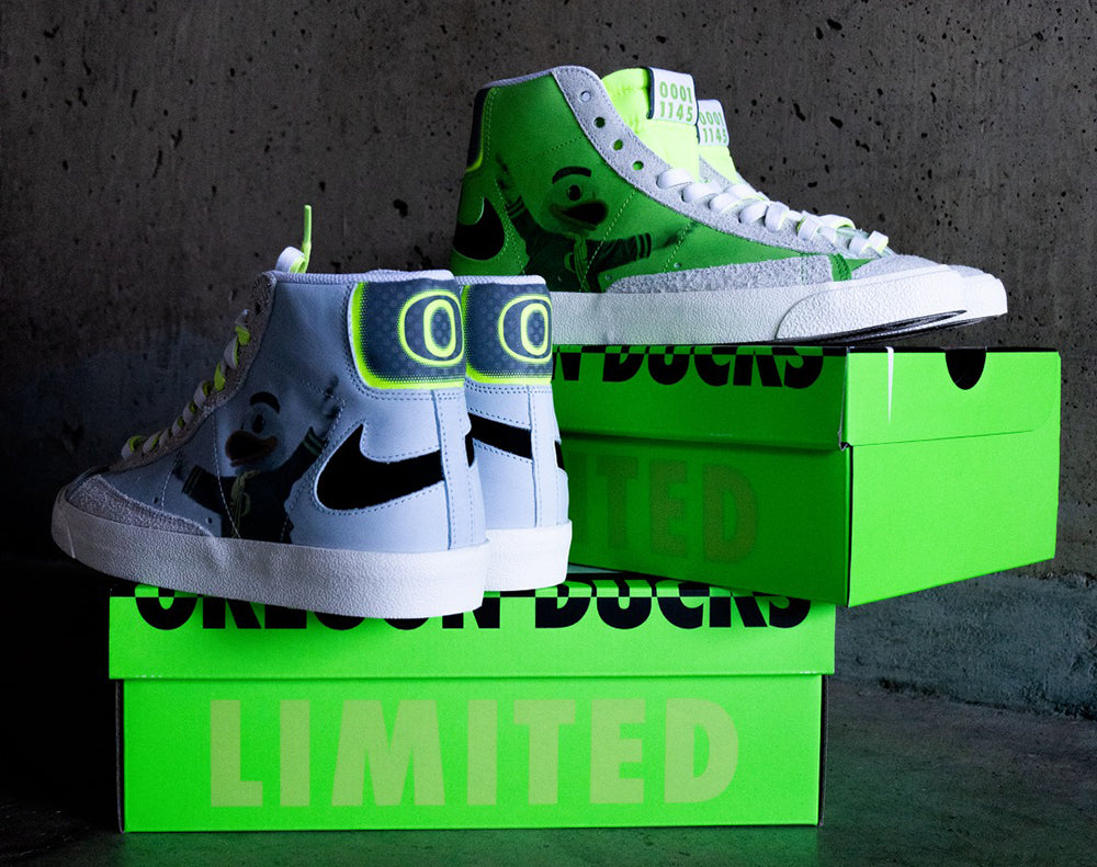 U of O Player Edition Blazer
The custom Nike Blazer retained the original high-top silhouette but shifted the Swoosh (in its original old-school silhouette) backward toward the heel to allow room for Oregon’s iconic mascot, The Duck, to take center stage. The exclusive Blazers were offered in three colorways—Gray, Green and Blue Tint—each featuring a numbered, bright green tongue.