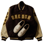 DOAF Varsity jacket with 'OREGON' text and shoe design on a white background. The sneakers reimagine the AF1 ’07 in a sophisticated combination of color and texture that manages to be both luxe and low-key at the same time. An ultra-premium high-texture suede upper in a creamy natural color.
The DOAF Varsity Jacket features a strong “OREGON” read across the chest and "DOAF" on the right sleeve. On the upper back, a metallic gold patch featuring the iconic “O” is stitched onto the jacket.
