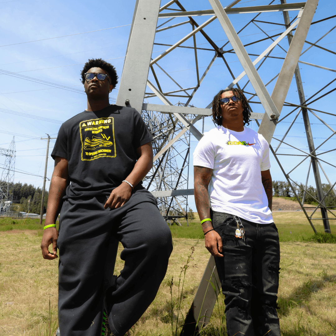 Two men wearing DOAF tees outside