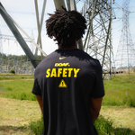 Image of man outside in a black tee with a DOAF graphic