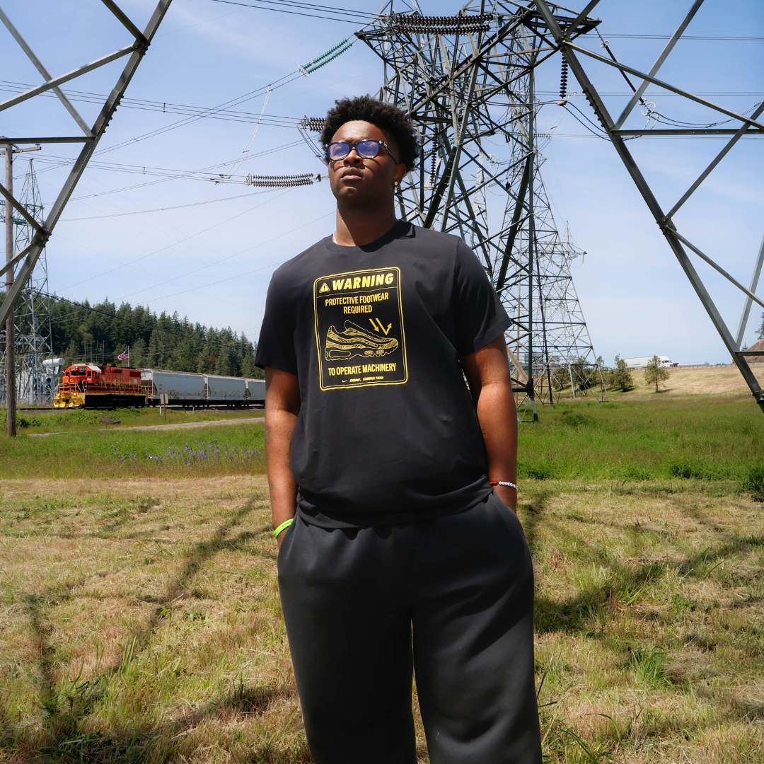 Tony Cumberland wearing a black DOAF graphic tee