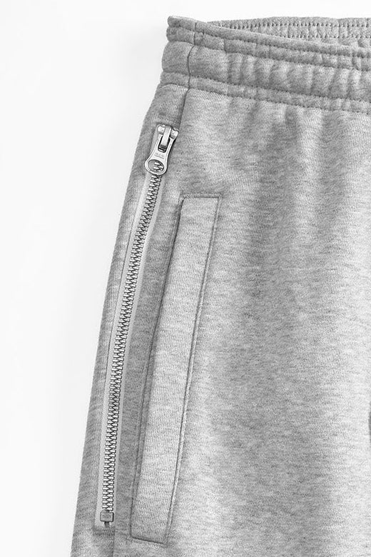 Detail of DOAF Speedway Gray sweatpants with a zipper pocket on a white background
