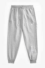 Gray  Speedway sweatpants with a Nike logo on a white background