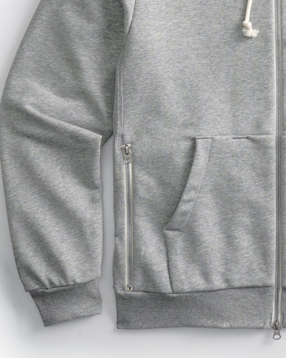 Side zipper detail of Gray Speedway zip-up hoodie on a white background