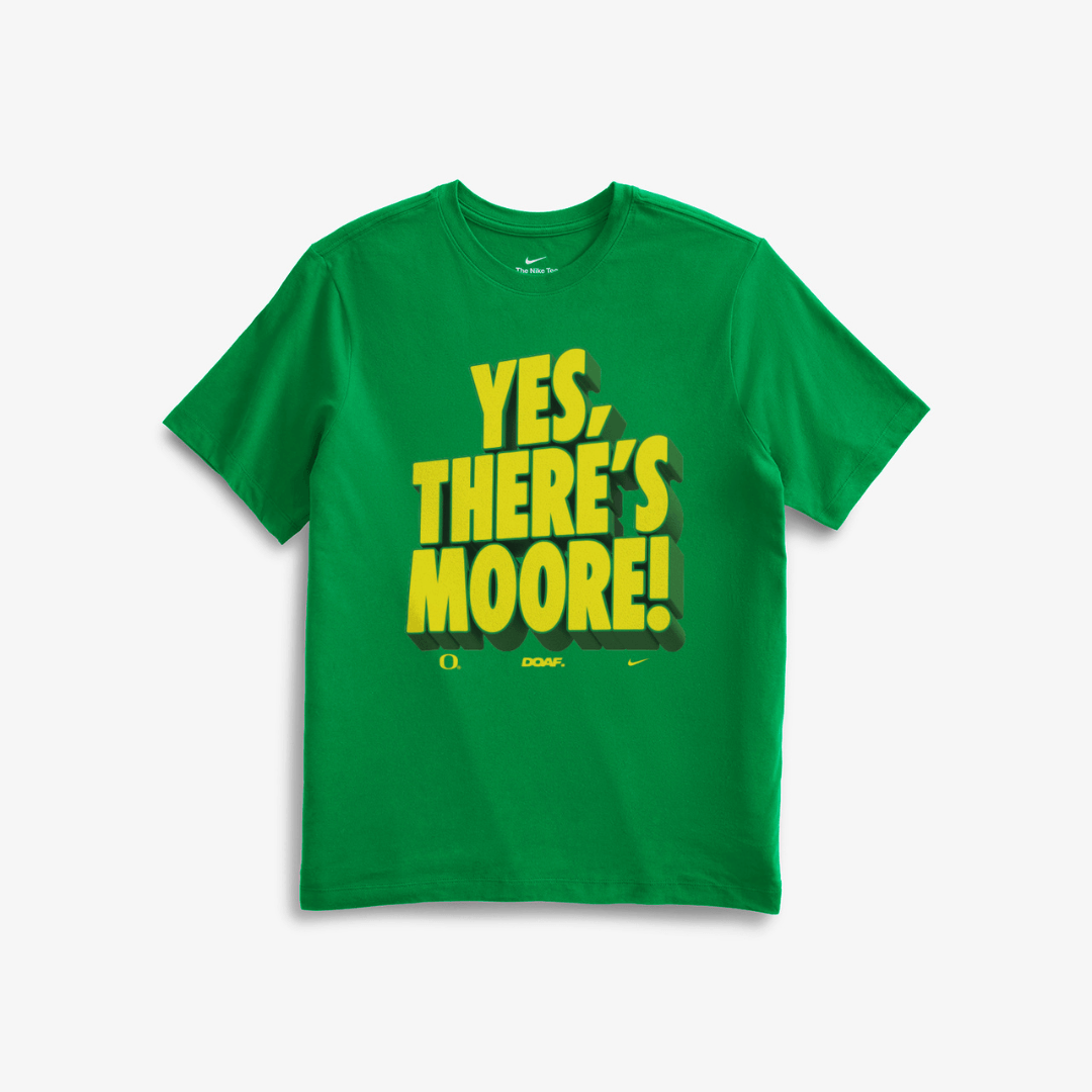 Green t-shirt with yellow text 'YES, THERE'S MOORE!' on a white background