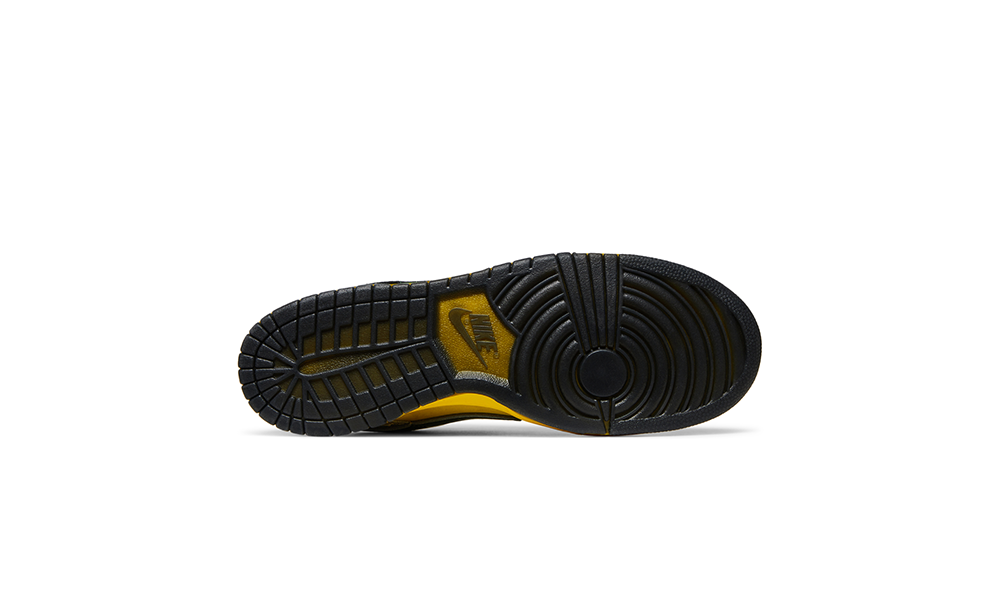 Black and yellow sneaker sole on a white background. DOAF What The Duck Nike Dunk Low “Home.” The colorful collage designs also pay homage to Oregon’s innovative use of textures, materials and stitching over the years. Incorporating reflective, metallic and neon elements that helped define Oregon’s distinct look on the field, the shoes both highlight the evolution of the Ducks' uniforms and celebrate the program’s continued impact on sports culture. 