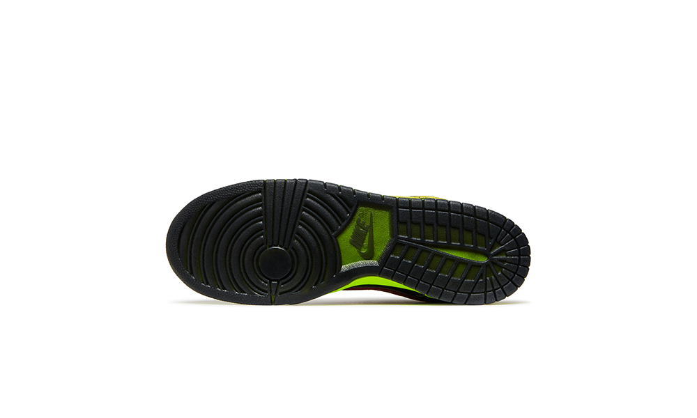 Black sneaker sole with green accents on a white background. DOAF What The Duck Nike Dunk Low “Home.” The colorful collage designs also pay homage to Oregon’s innovative use of textures, materials and stitching over the years. Incorporating reflective, metallic and neon elements that helped define Oregon’s distinct look on the field, the shoes both highlight the evolution of the Ducks' uniforms and celebrate the program’s continued impact on sports culture. 